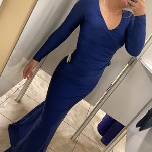 Bright blue tight fit special occasion or prom dress. Size xs .